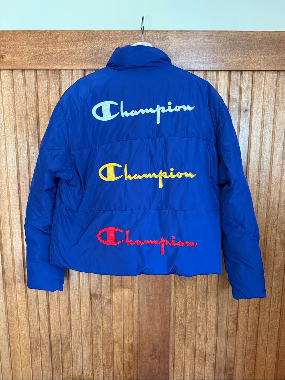 Champion Royal Blue Puffer Jacket with White, Yellow & Red Logos